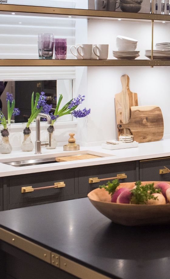 Brushed brass hardware and stainless-steel fixtures provide an interesting mixed metal look.