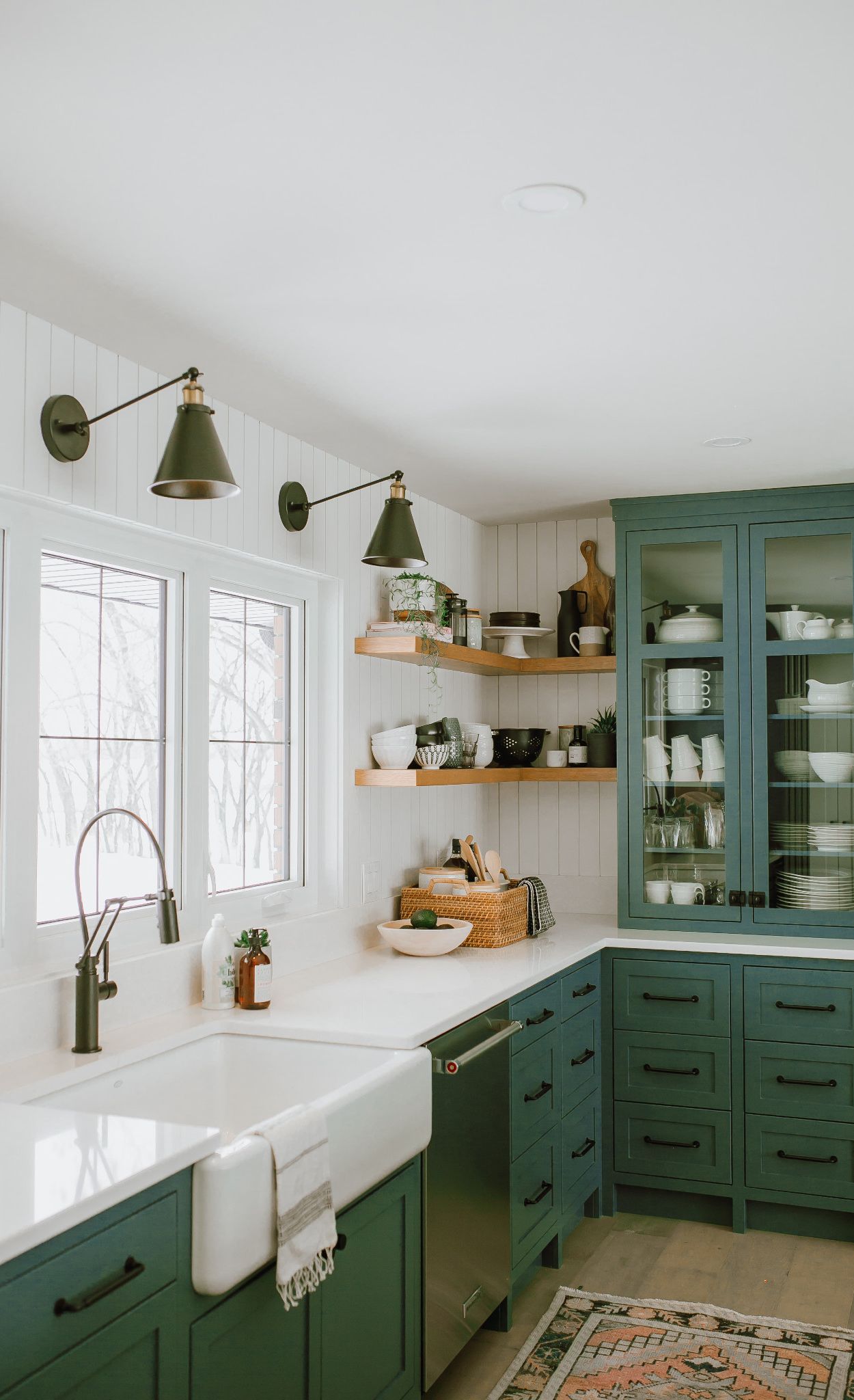 Cambria Newport paired with green cabinets and open shelving.