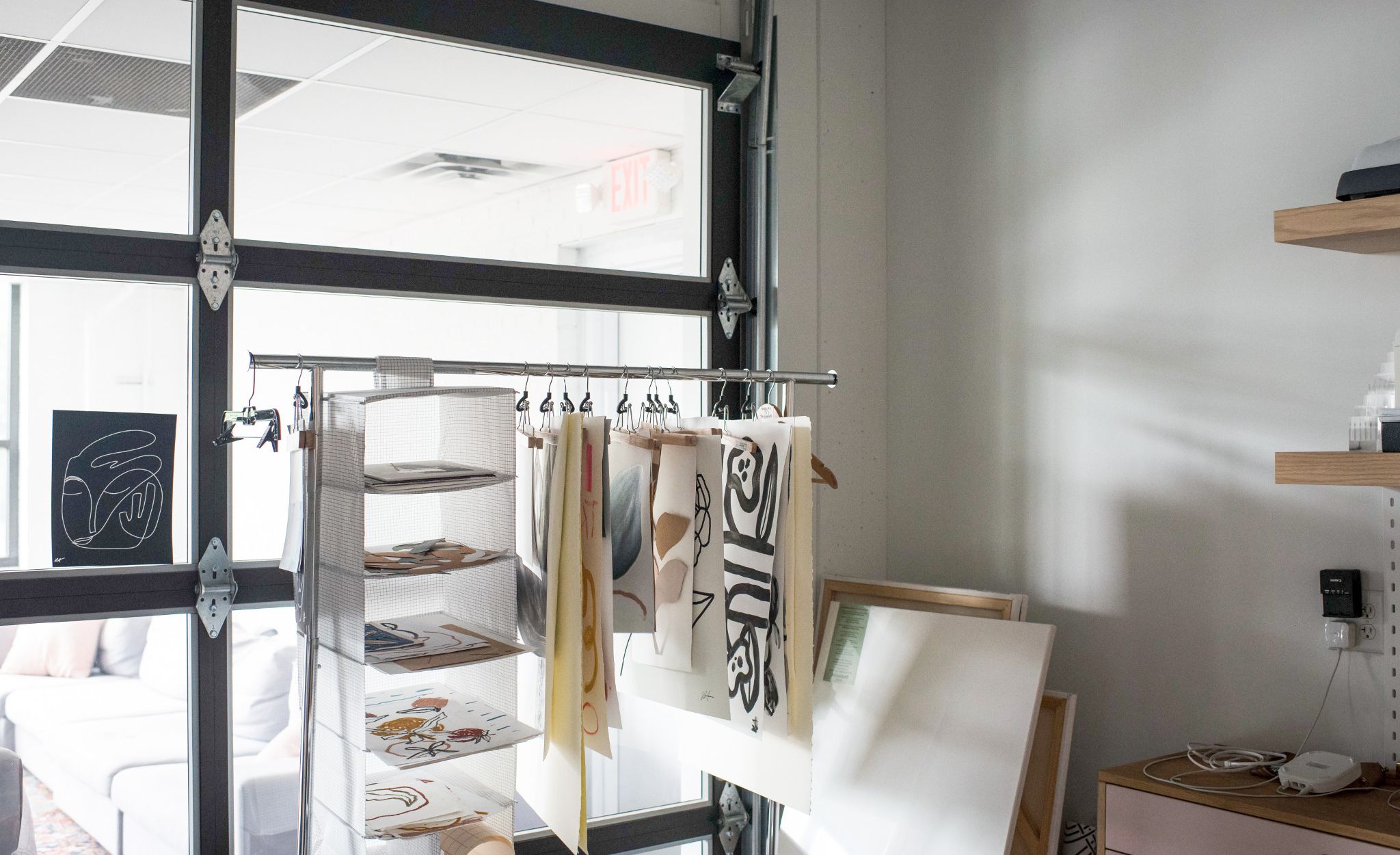 The addition of garage doors to the interior workspace gives a nod to the building’s heritage while allowing in natural light for an open, airy feel.