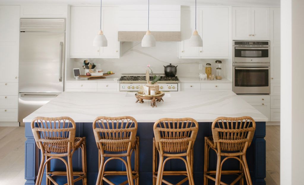 White and blue kitchen featuring Cambria Brittanicca Warm Matte.