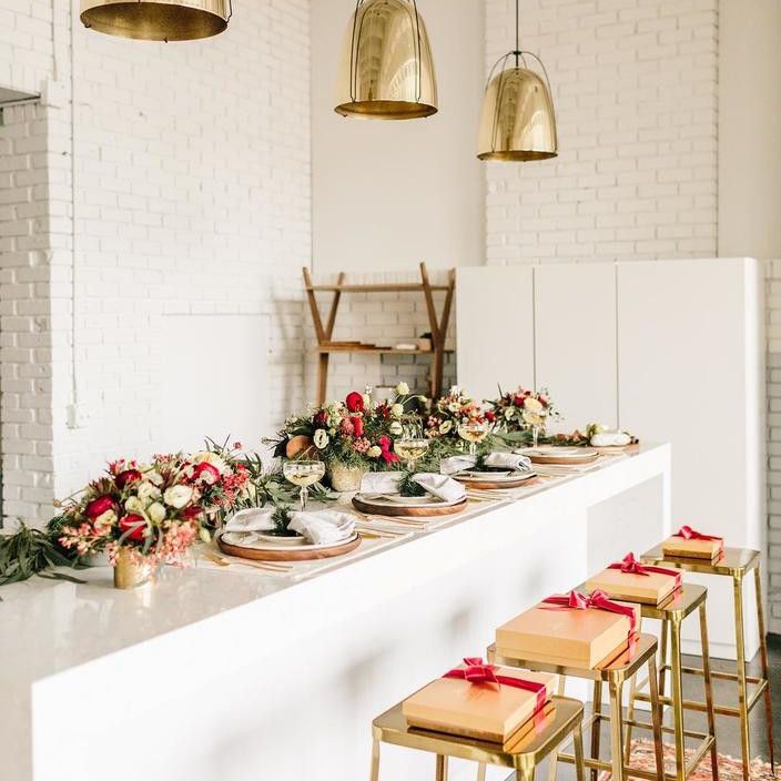 Greet guests with festive chocolate boxes atop each barstool.