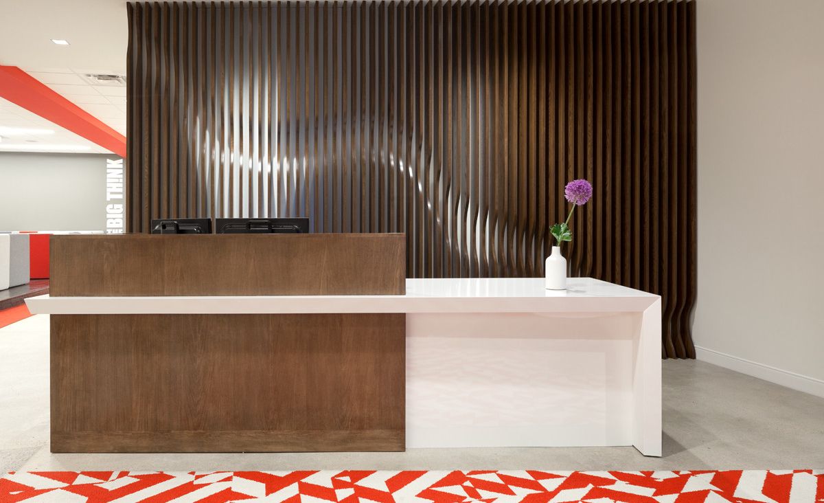 Workplace reception desk featuring Cambria White Cliff