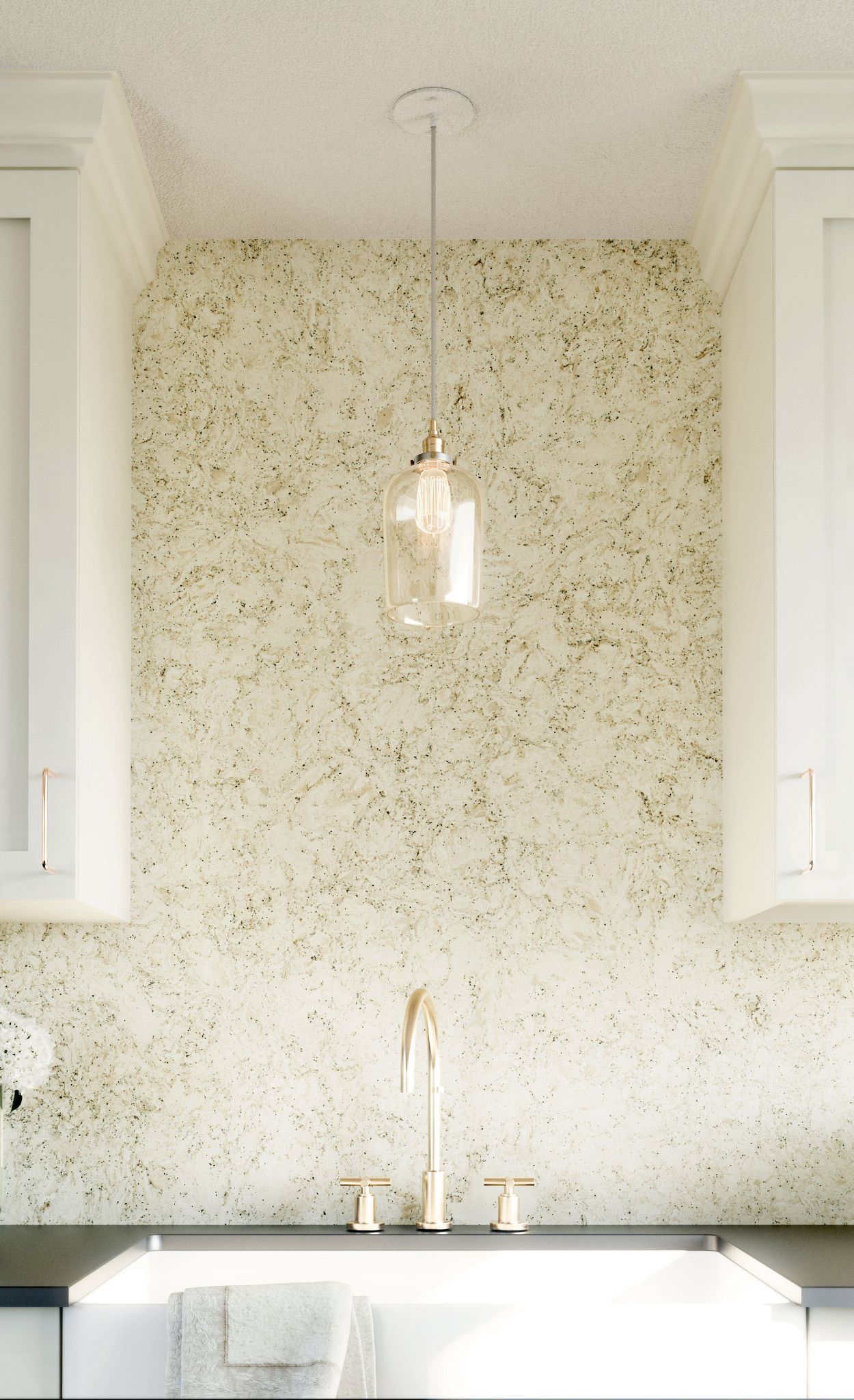 A Cambria Pendle Hill backsplash pairs with dark countertops and white cabinetry for an elegant neutral palette.