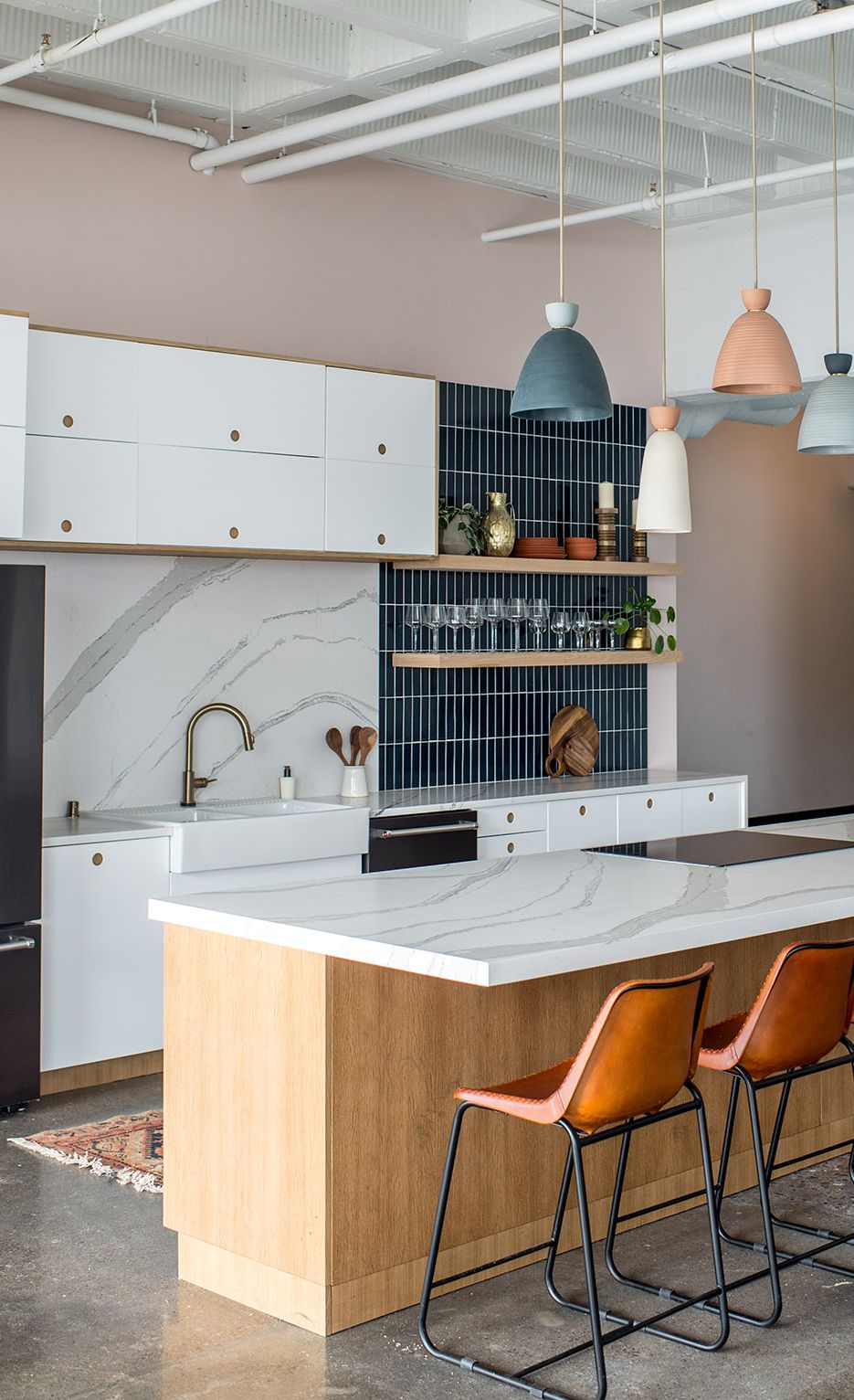Brittanicca Matte™ and vertical subway tile backsplash.
