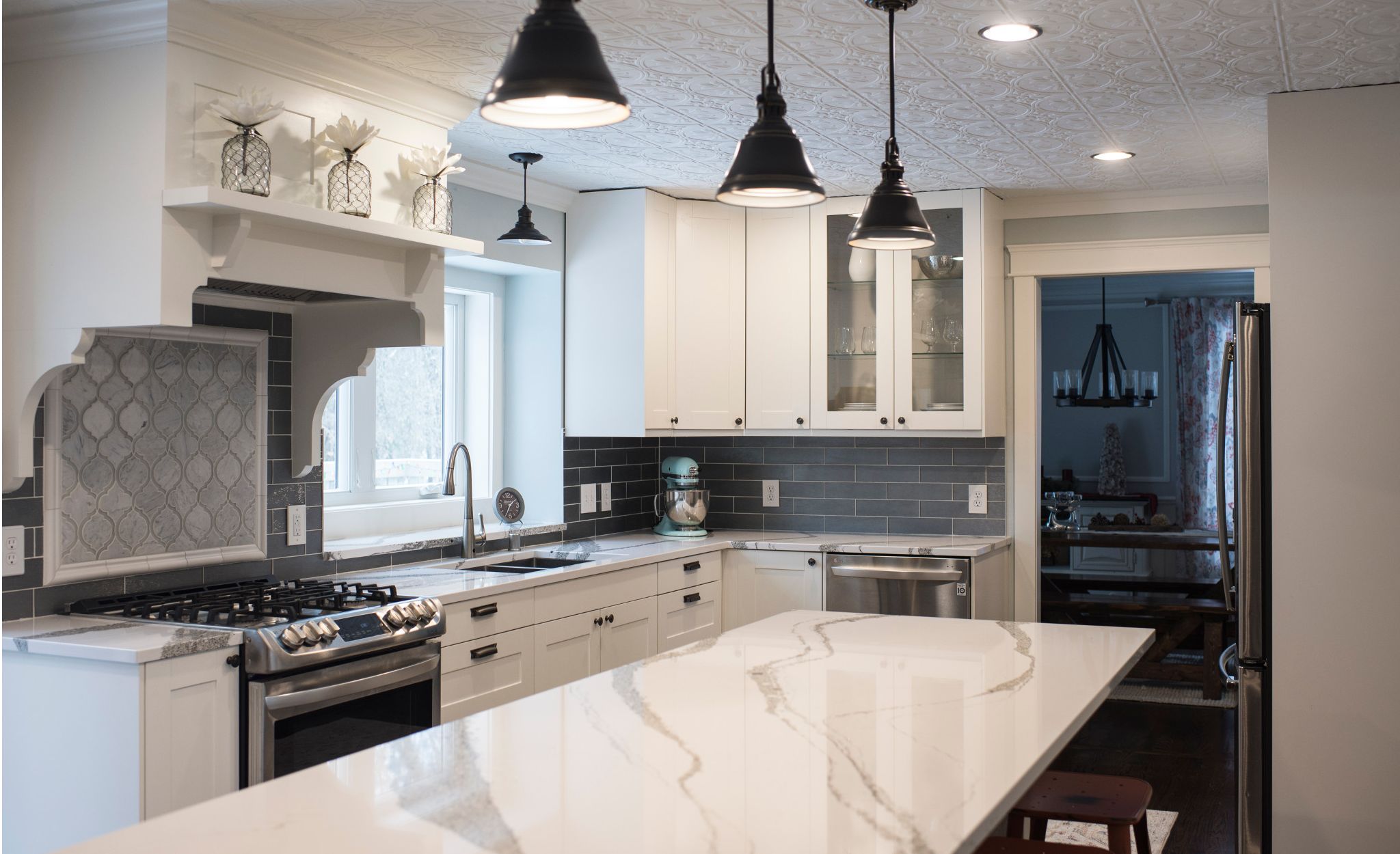 A gray and white kitchen with Cambria Annicca countertops.