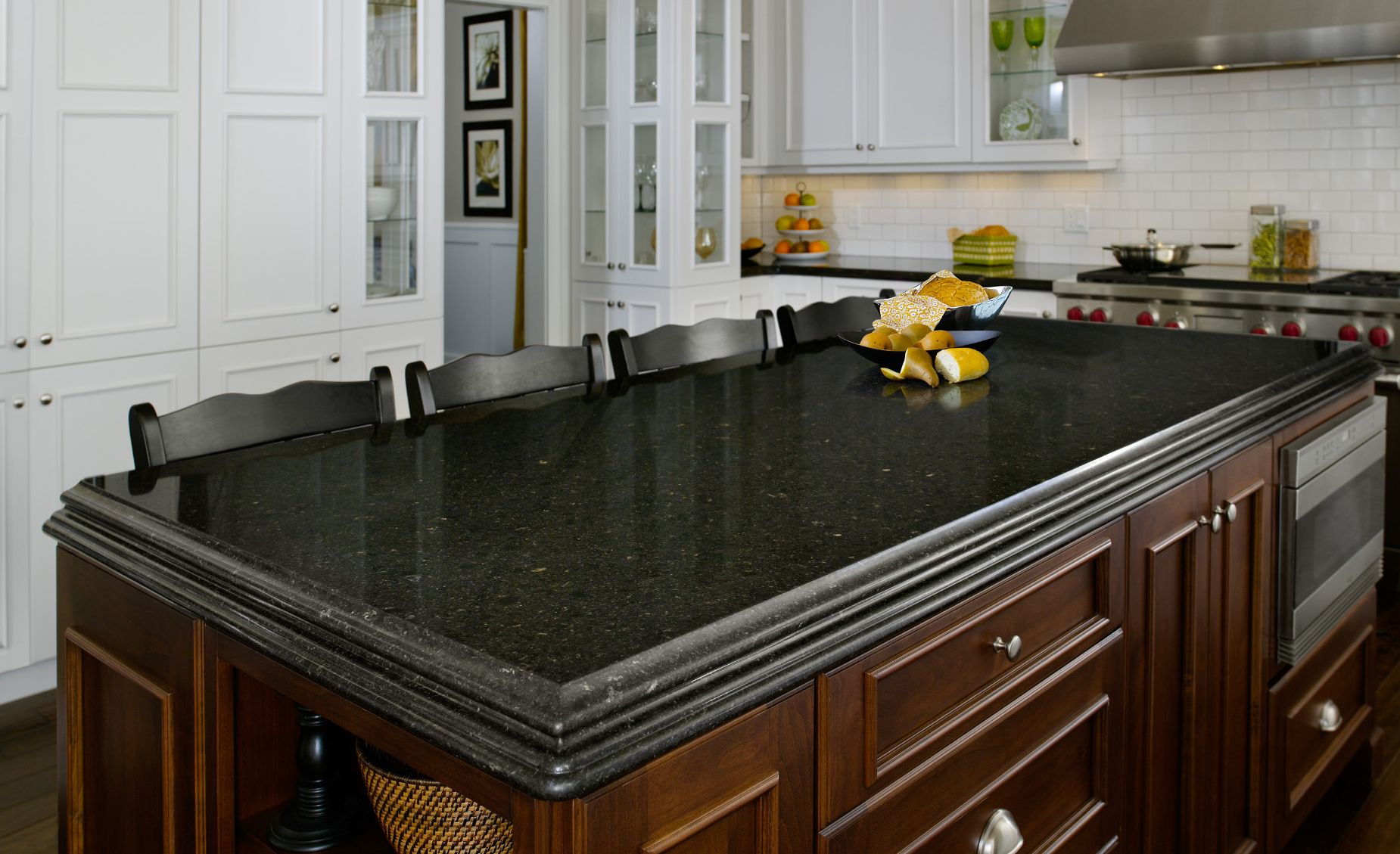 Cambria Blackwood offers a sophisticated alternative to black granite in this traditional kitchen.