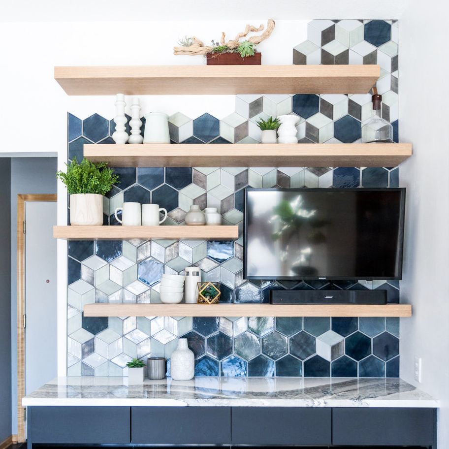 A kitchen and dining space bar with Cambria Skara Brae countertops and a backsplash created by Mercury Mosaics.