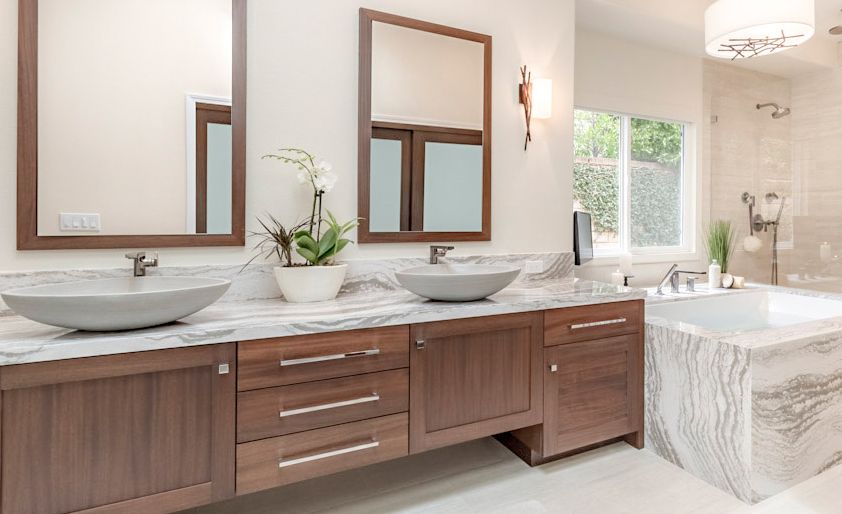 Cambria Oakmoor provides a wood alternative for this mater bath.