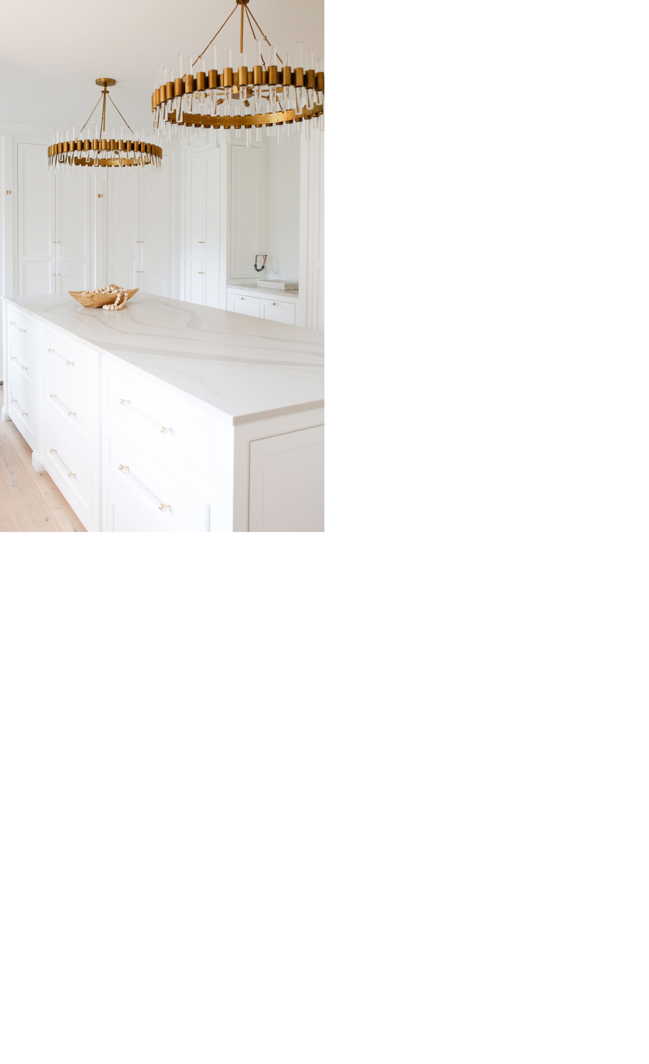 Closet renovation featuring spacious island with Brittanicca Warm Matte™.