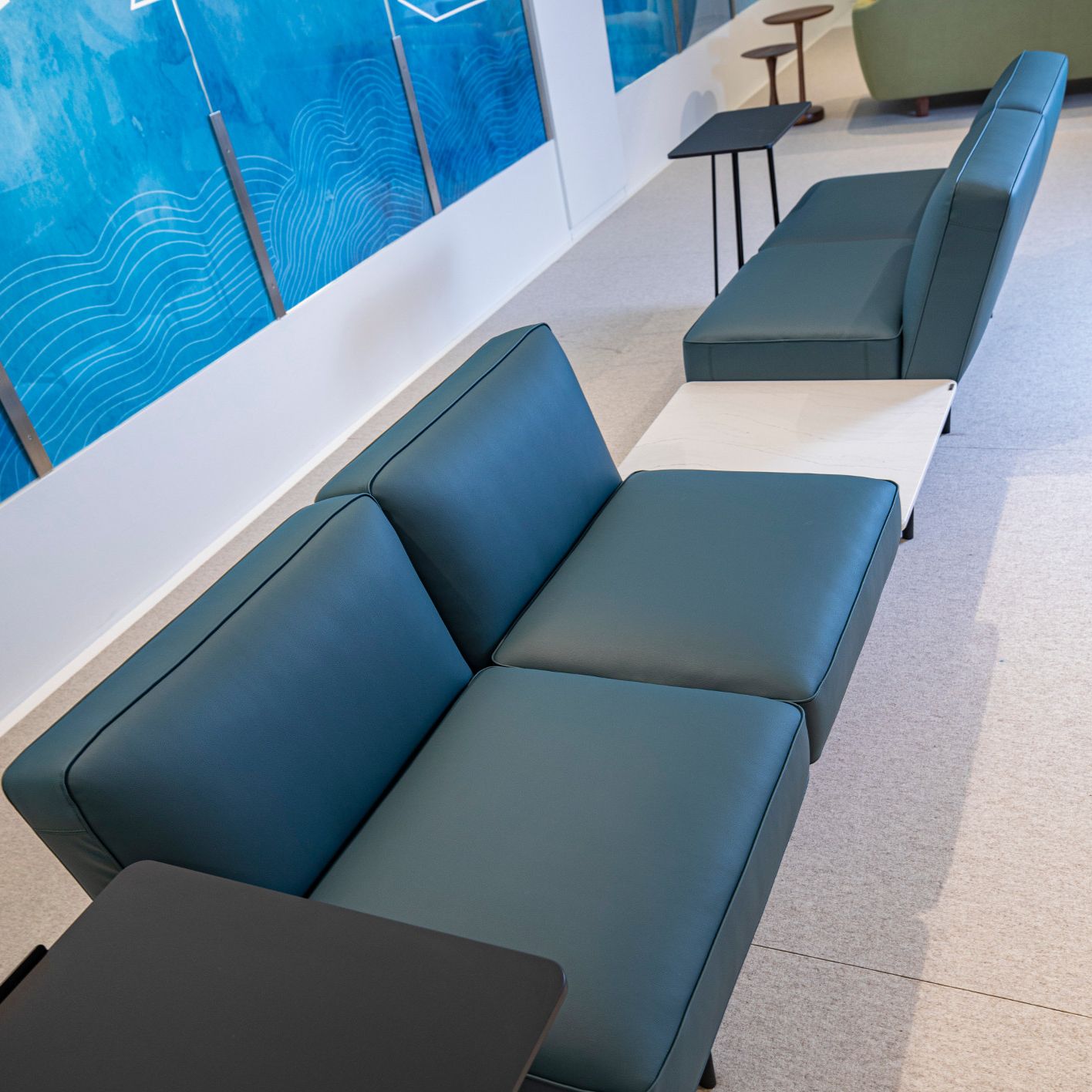 Cambria Ella integrated waiting room table and seating.