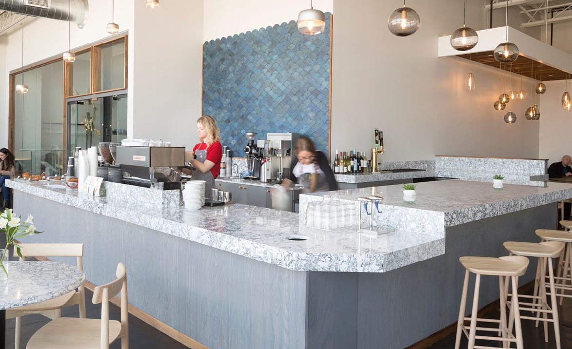 Cambria Rosedale countertops and custom tables create a contemporary marble alternative.