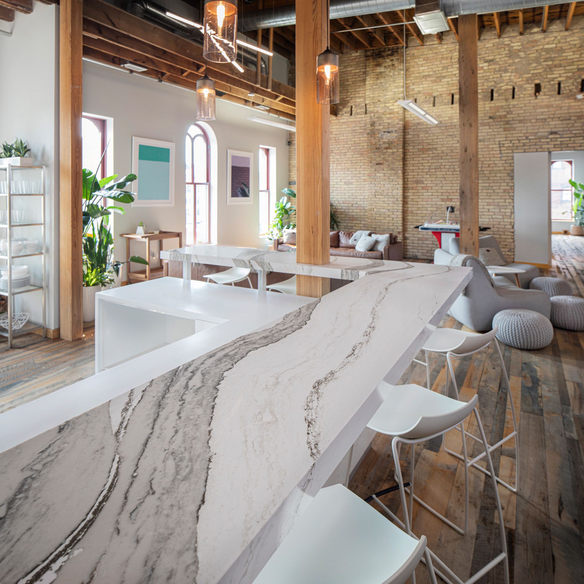 A detailed view of a bar in a retail and event space featuring Cambria Skara Brae countertops.