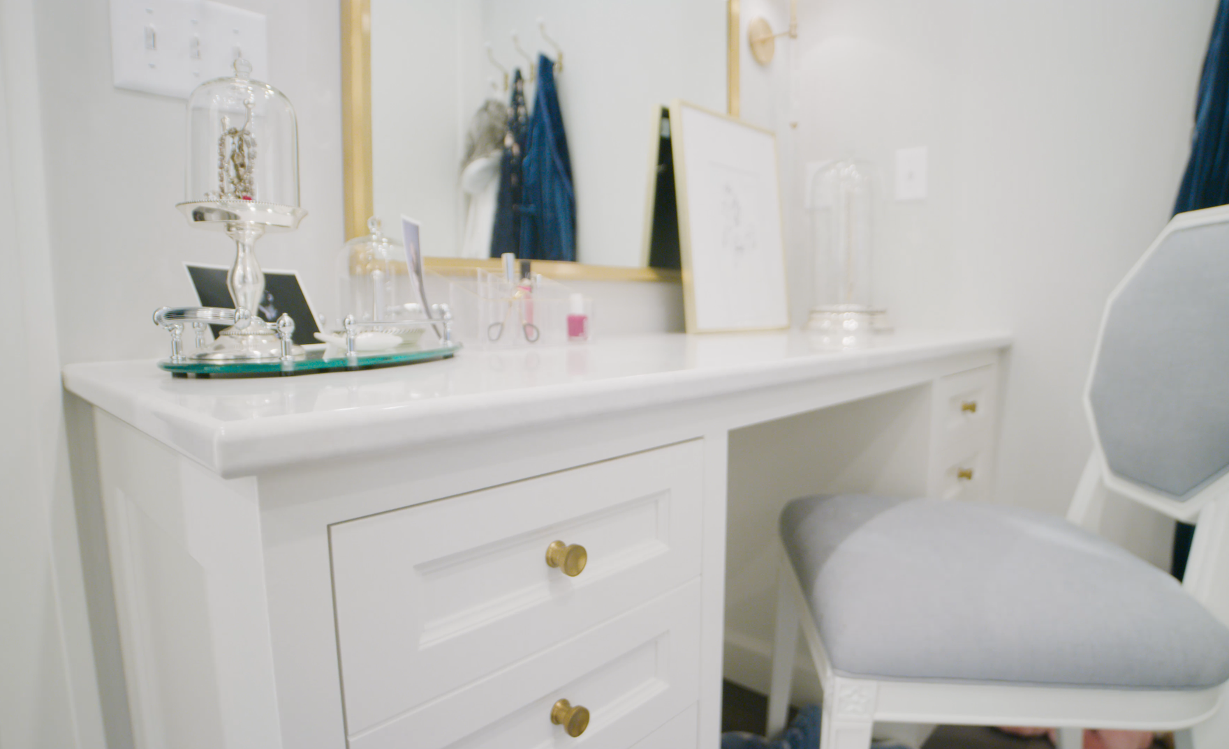 A white vanity paired with Cambria Delgatie countertops.