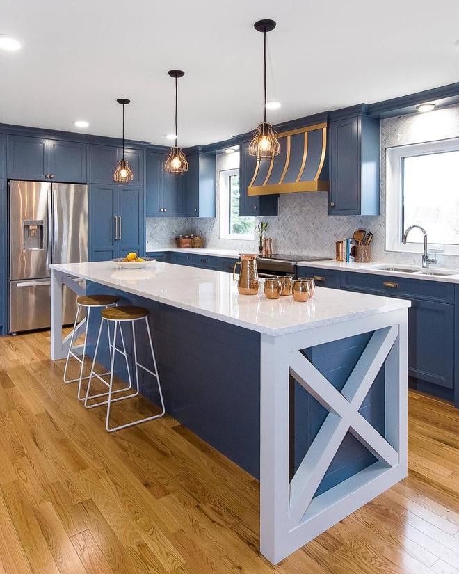 Slate blue and white kitchen featuring Cambria Swanbridge.