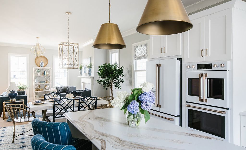 A bright white space is complimented by brass accents and Brittanicca Gold.
