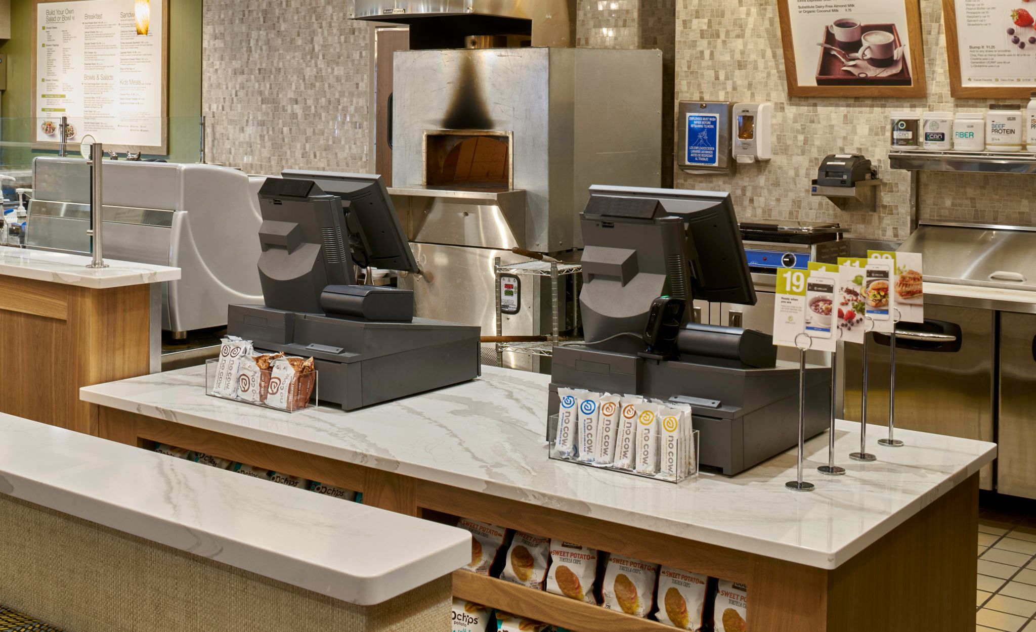 Durable Cambria Brittanicca Warm rails and countertops provide marble-like beauty.