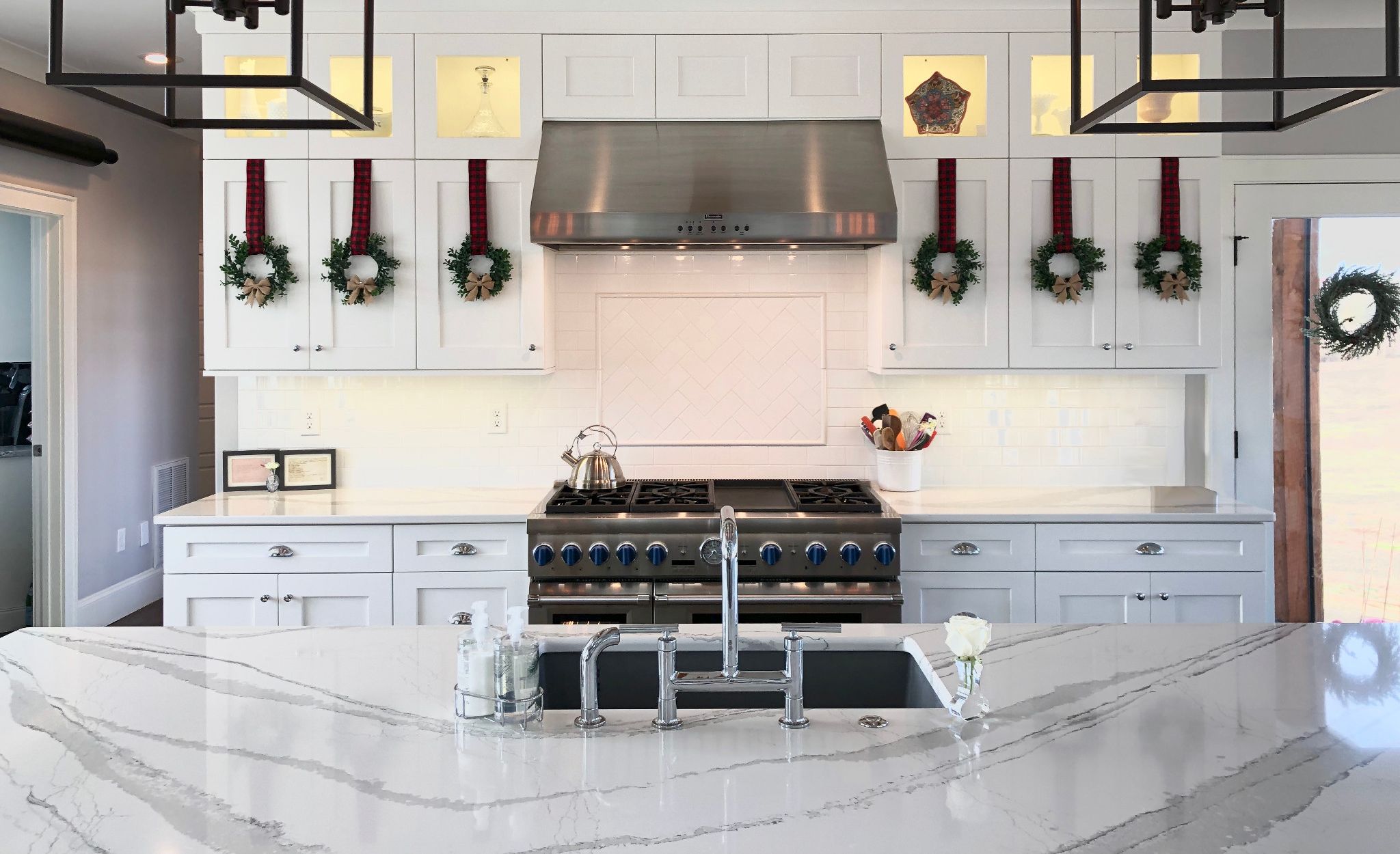 A simple splash of greenery creates Christmas cheer in this Brittanicca kitchen.