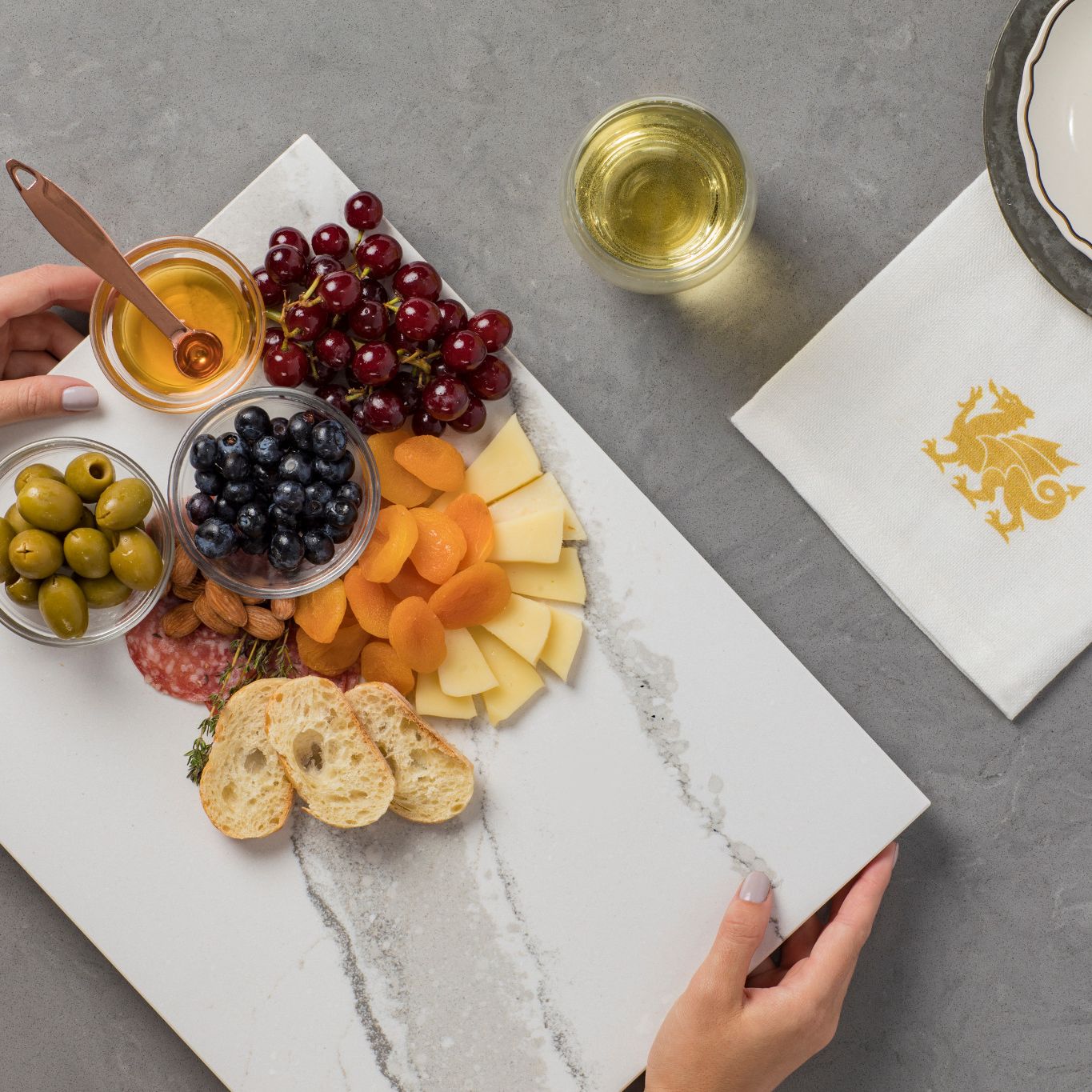 Cambria Brittanicca cheese plate being placed on a table.