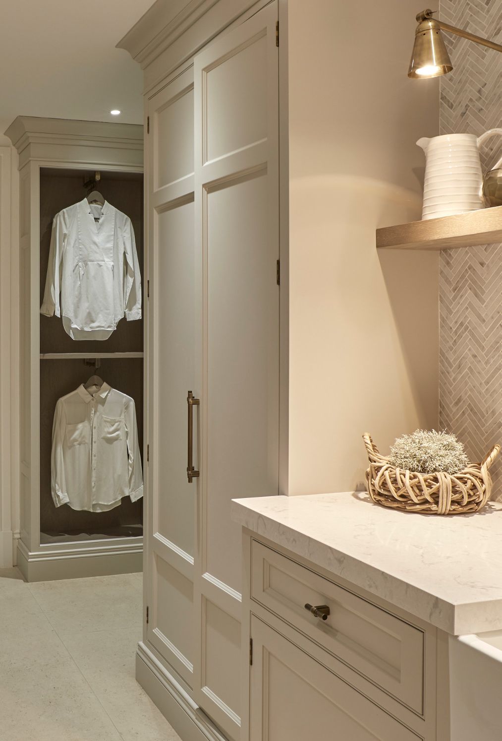 Cream cabinets and marble chevron tile paired with Camrbia Swanbridge countertops.