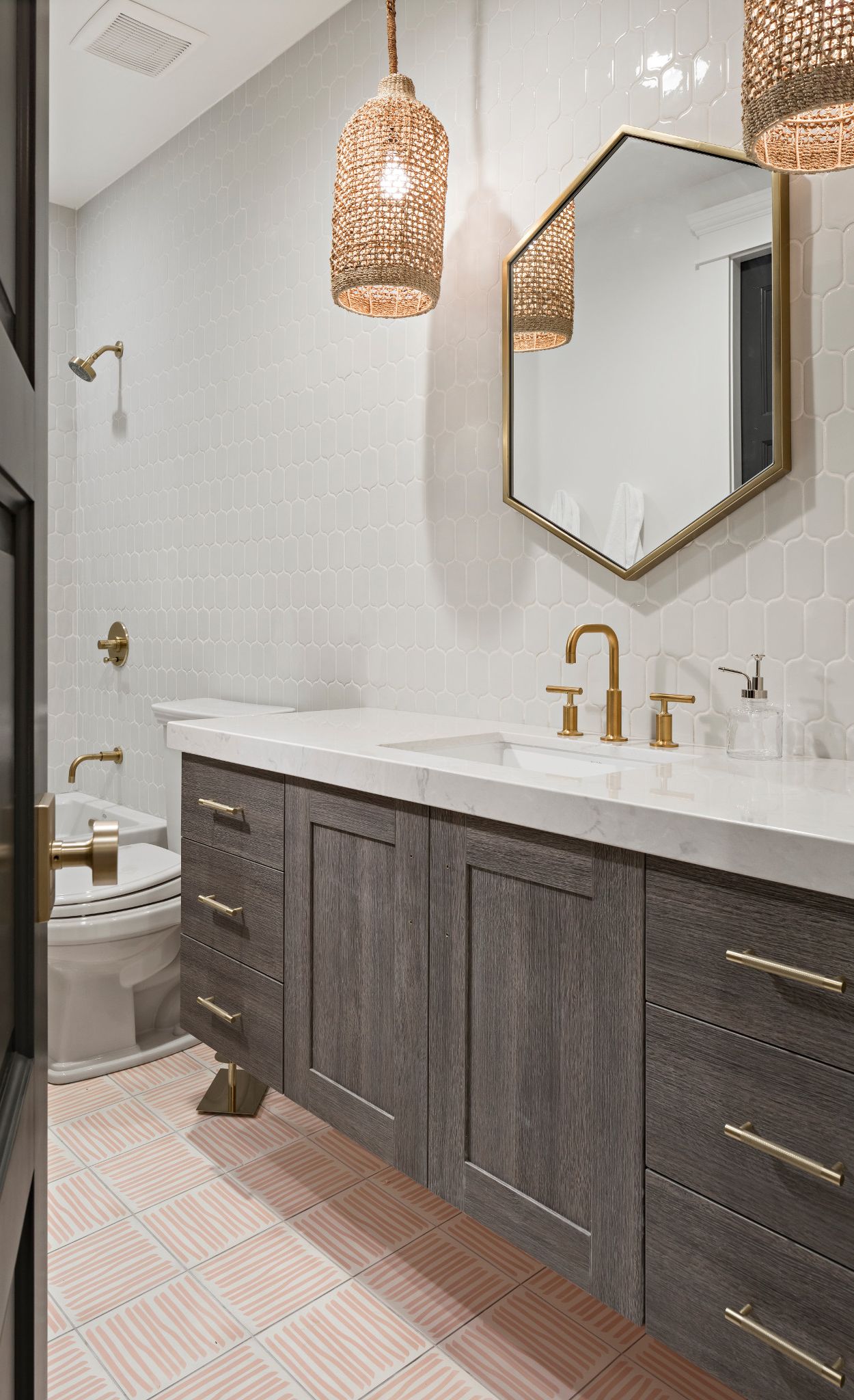 Pair a wood cabinet vanity with Cambria Swanbridge and geometric shapes.