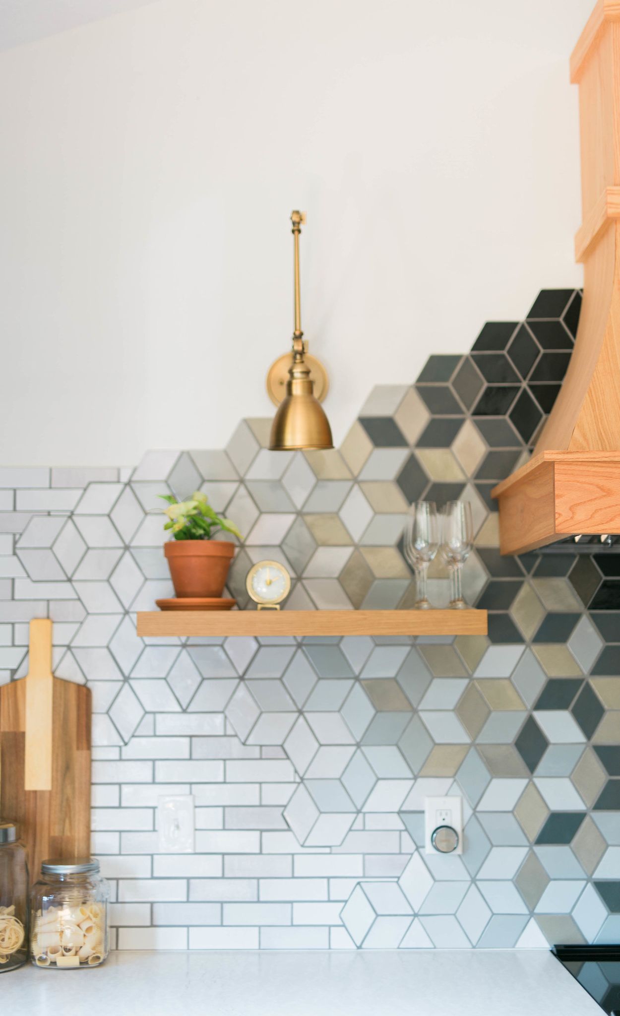 Bold mosaic-tile backsplash paired beautifully with Cambria Delgatie.