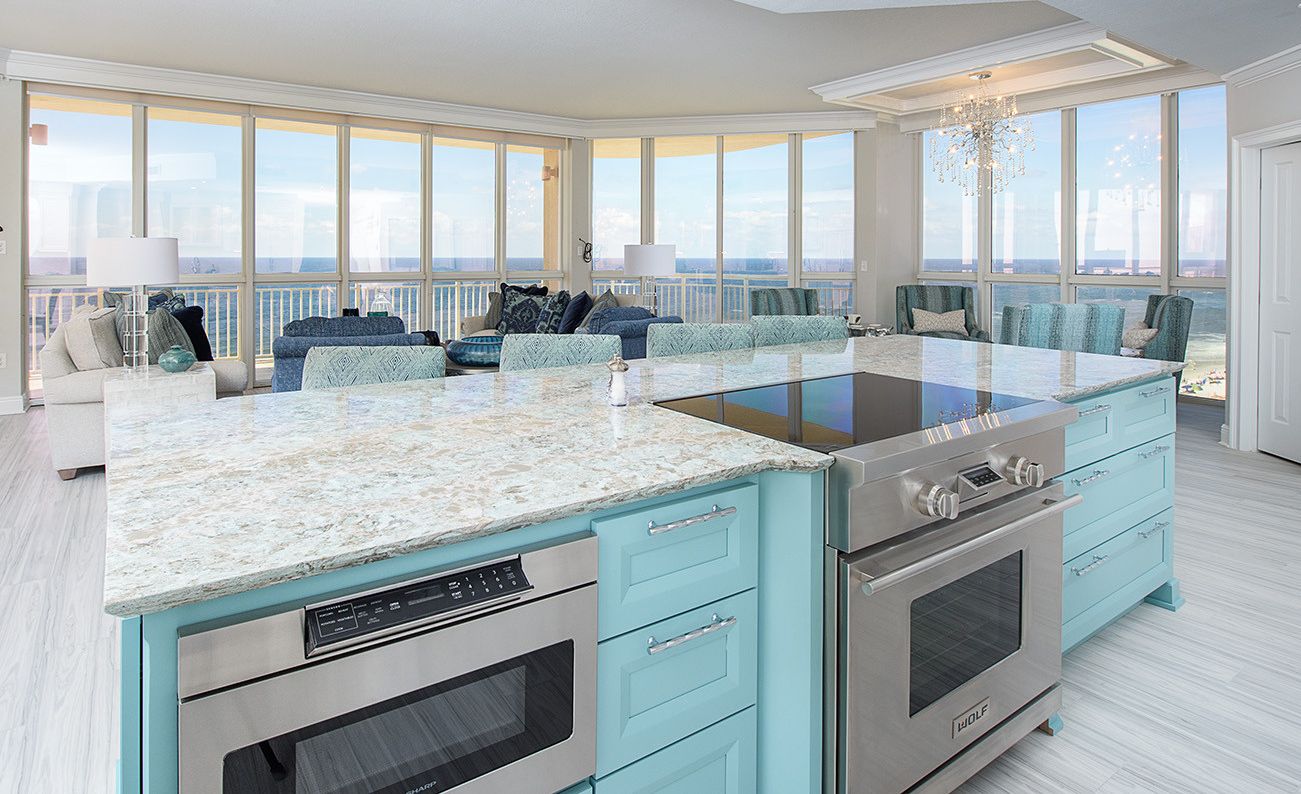 Coastal kitchen island with Cambria Kelvingrove countertops.