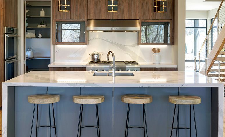 A quartz backsplash in Brittanicca provides a luxe marble look.