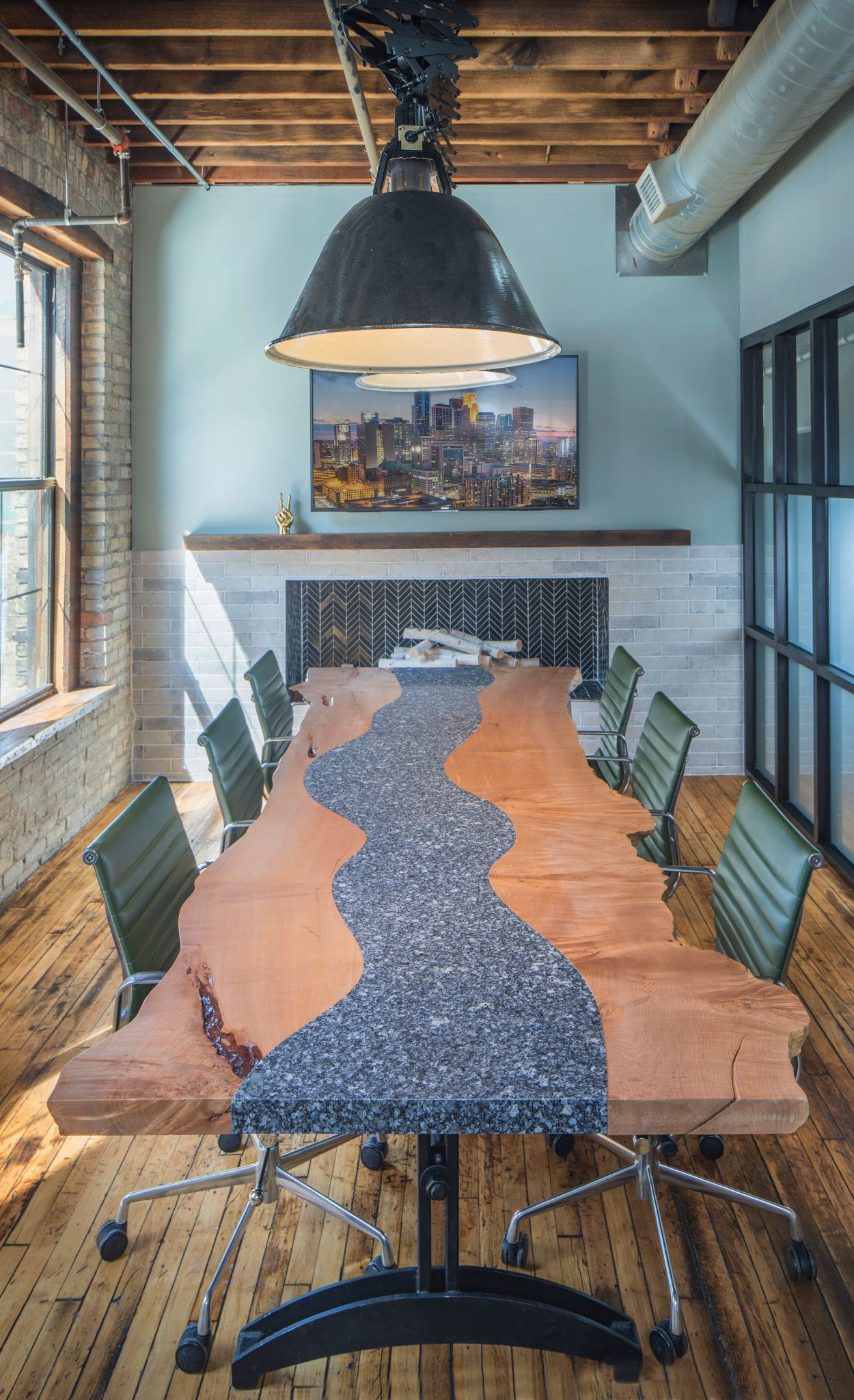 Custom Parys table combine with wood for a modern meeting space.