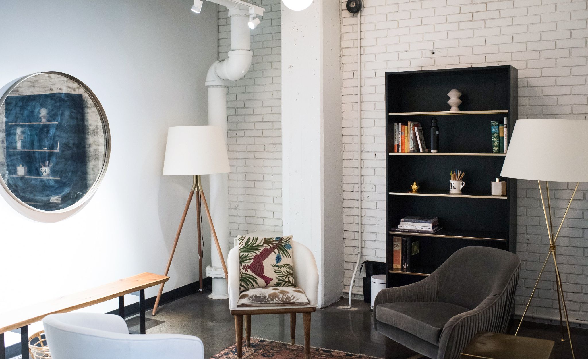 A lounge just past the studio entryway offers a waiting area for guests and casual meeting environment.