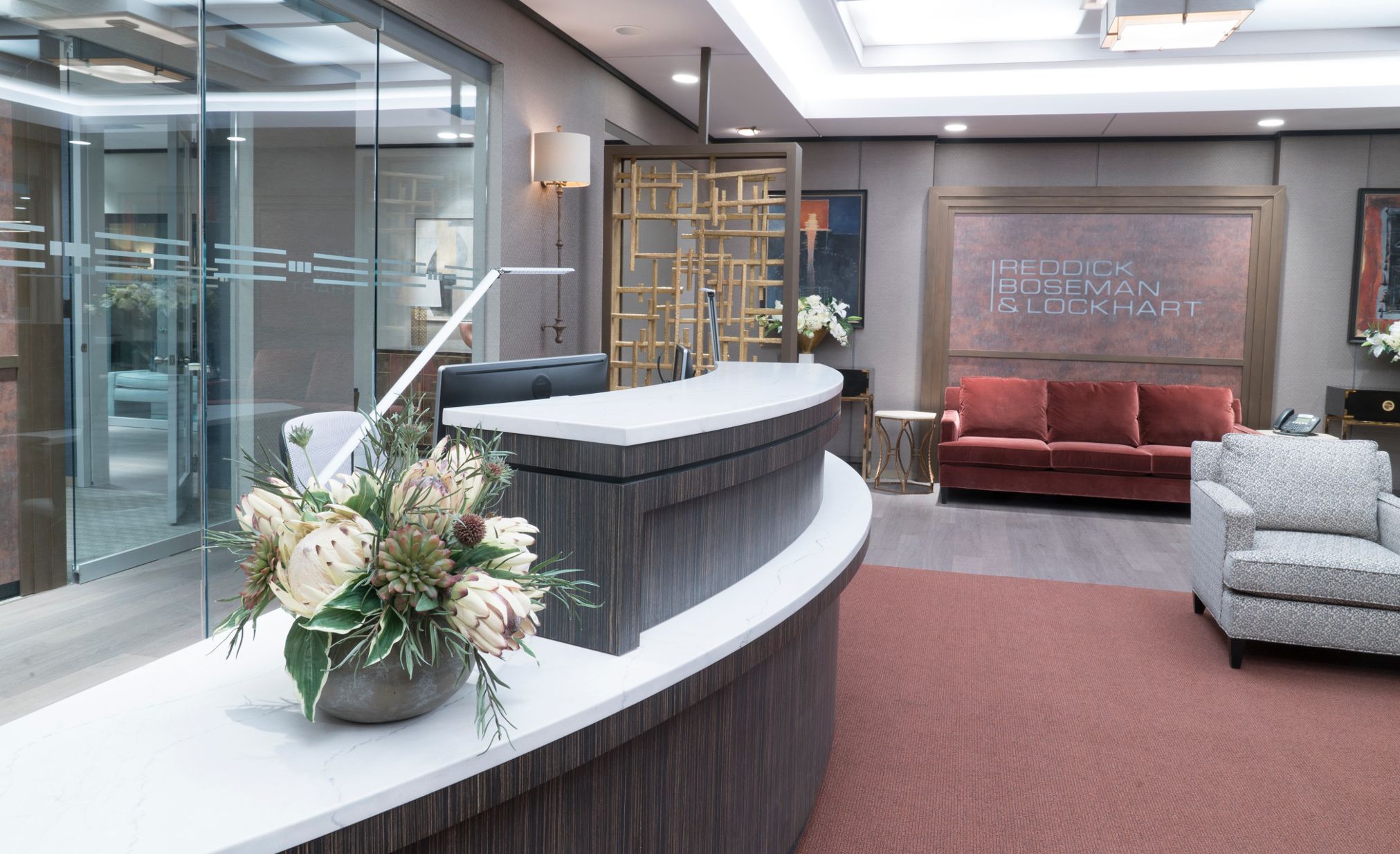 Law firm office reception desk with Cambria Ella Matte countertops on the set of CBS’s “The Good Fight.”