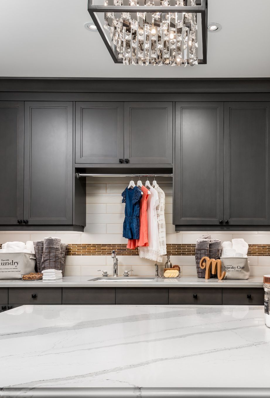 View from other side of a laundry room with Cambria Brittanicca countertops.