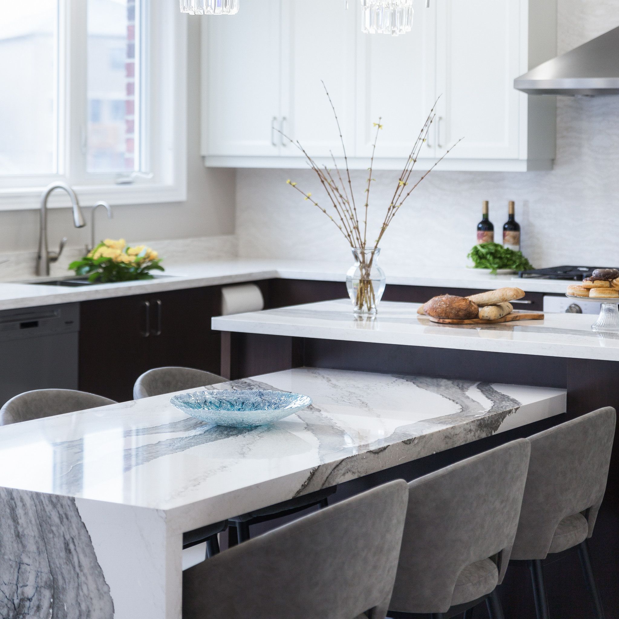 A kitchen with a sink and a window
Description automatically generated