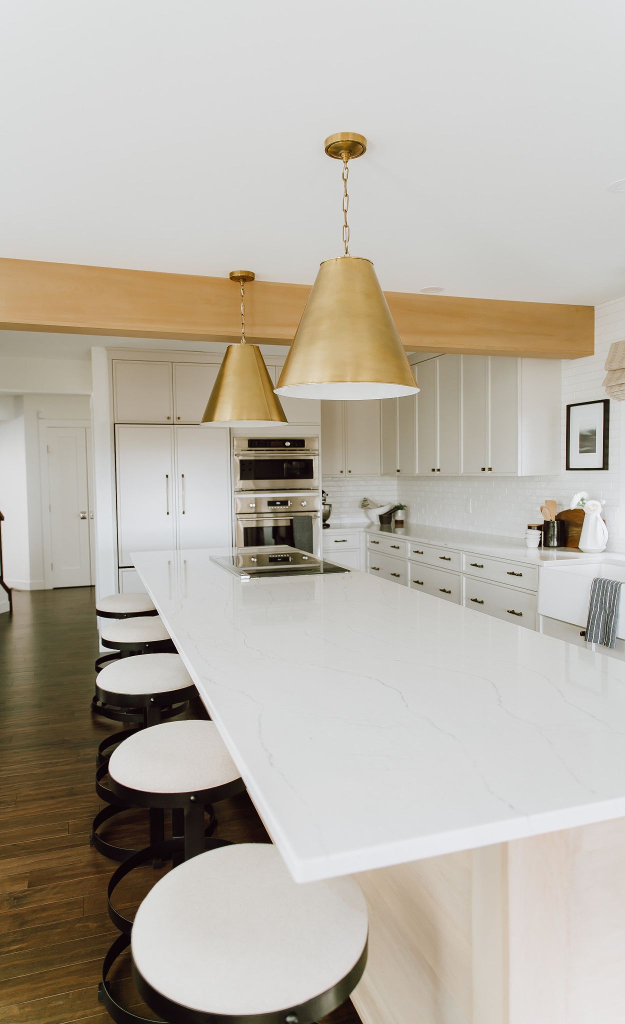 Cambria Ella kitchen island paired with wood cabinets.