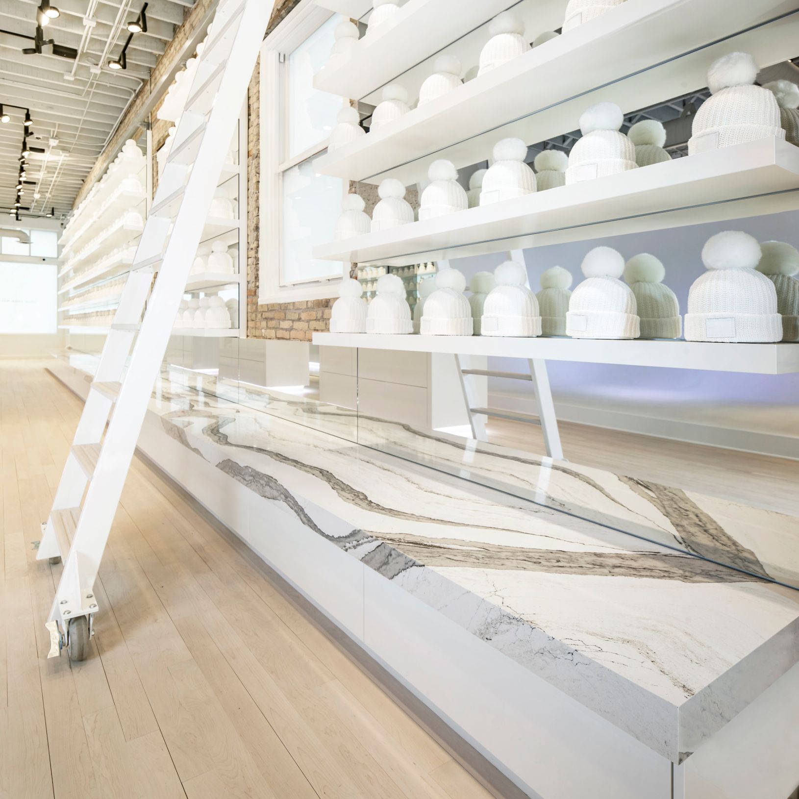 A retail store featuring a display with a bench made out of Cambria Skara Brae.