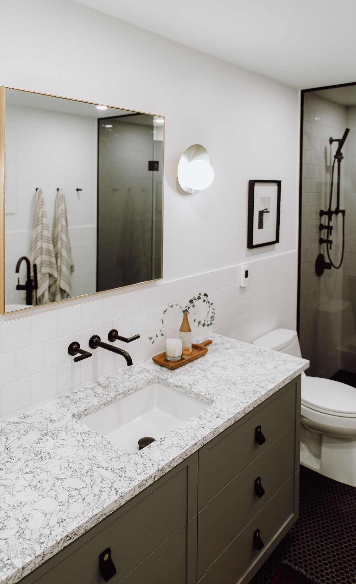 Cambria Rosedale with sage green cabinets and leather pulls from CB2.