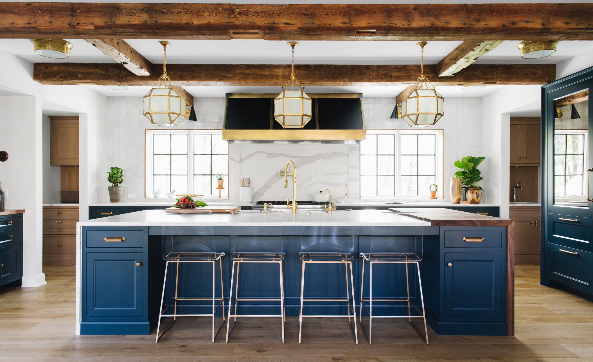 Custom Cambria Brittanicca Matte™ backsplash in a high-contrast kitchen.
