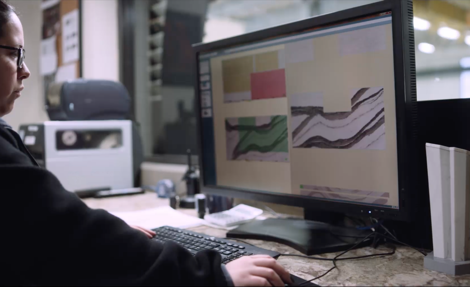 A Cambria employee uses computer software to create outlines for a slab