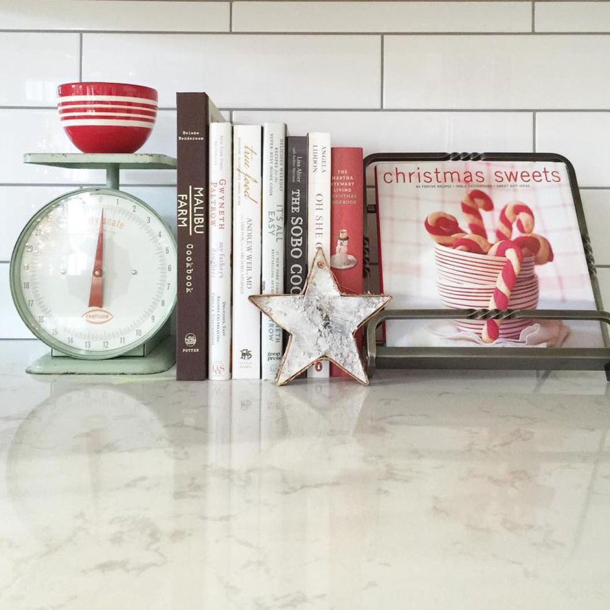 Utilize colorful cook books when decorating your kitchen for Christmas.