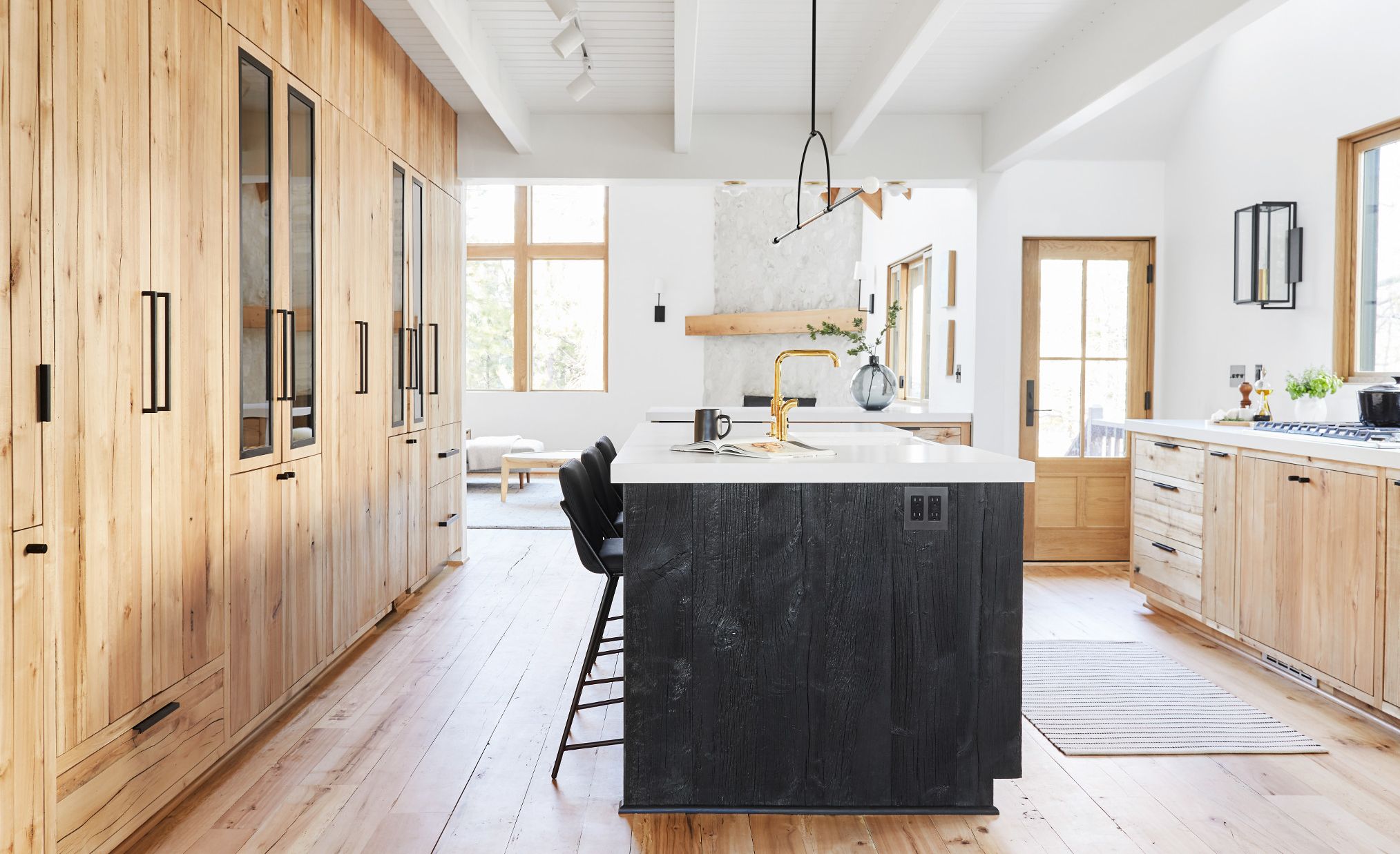 Cambria White Cliff Matte paired with light wood and black stained cabinets.