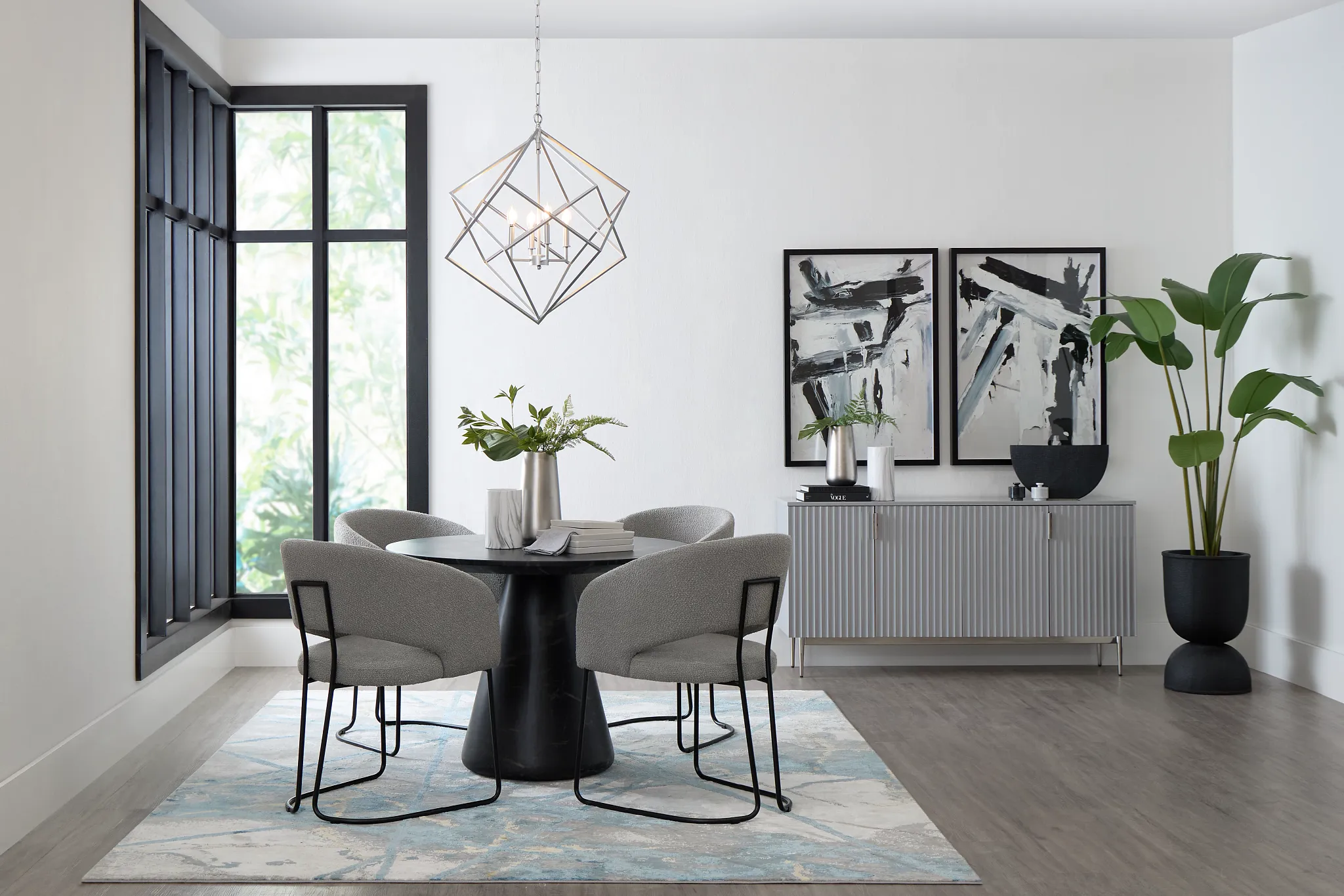 Merrick Black Round Table With 4 Gray Upholstered Side Chairs