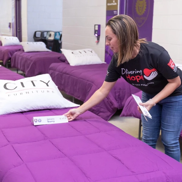 Dolphins, CITY Furniture Gift Beds to Children at Delivering Hope 