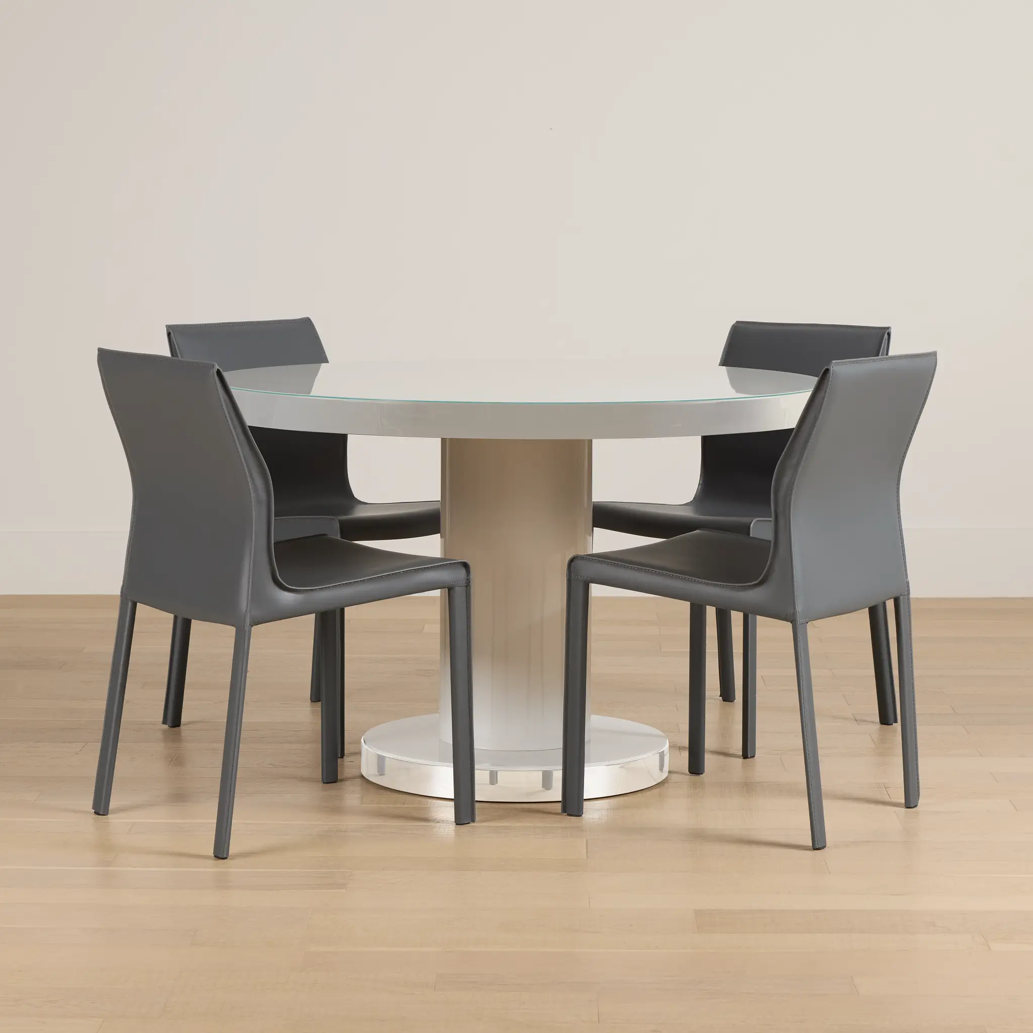 Miami White 47" Round Table & 4 Upholstered Chairs Miami White 47" Round Table & 4 Upholstered Chairs