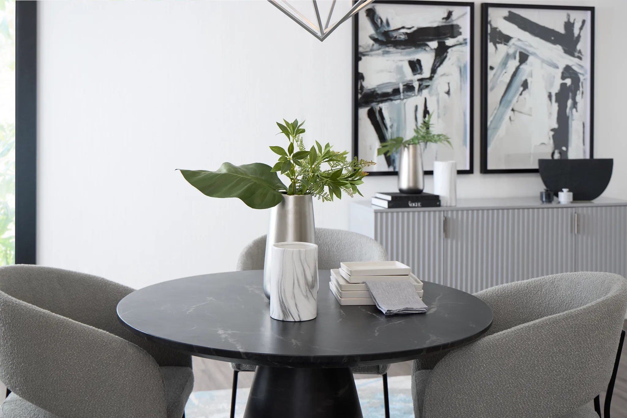 Merrick Black Round Table With 4 Gray Upholstered Side Chairs