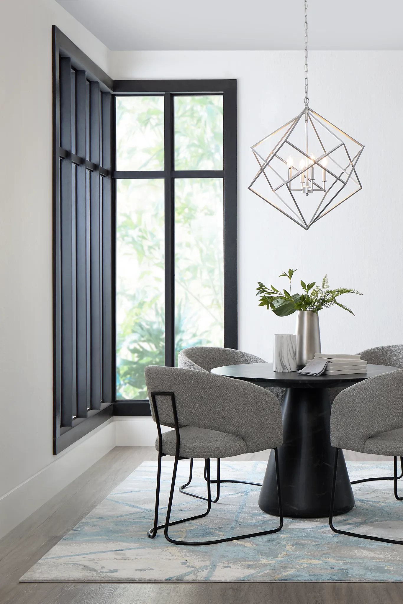 Merrick Black Round Table With 4 Gray Upholstered Side Chairs