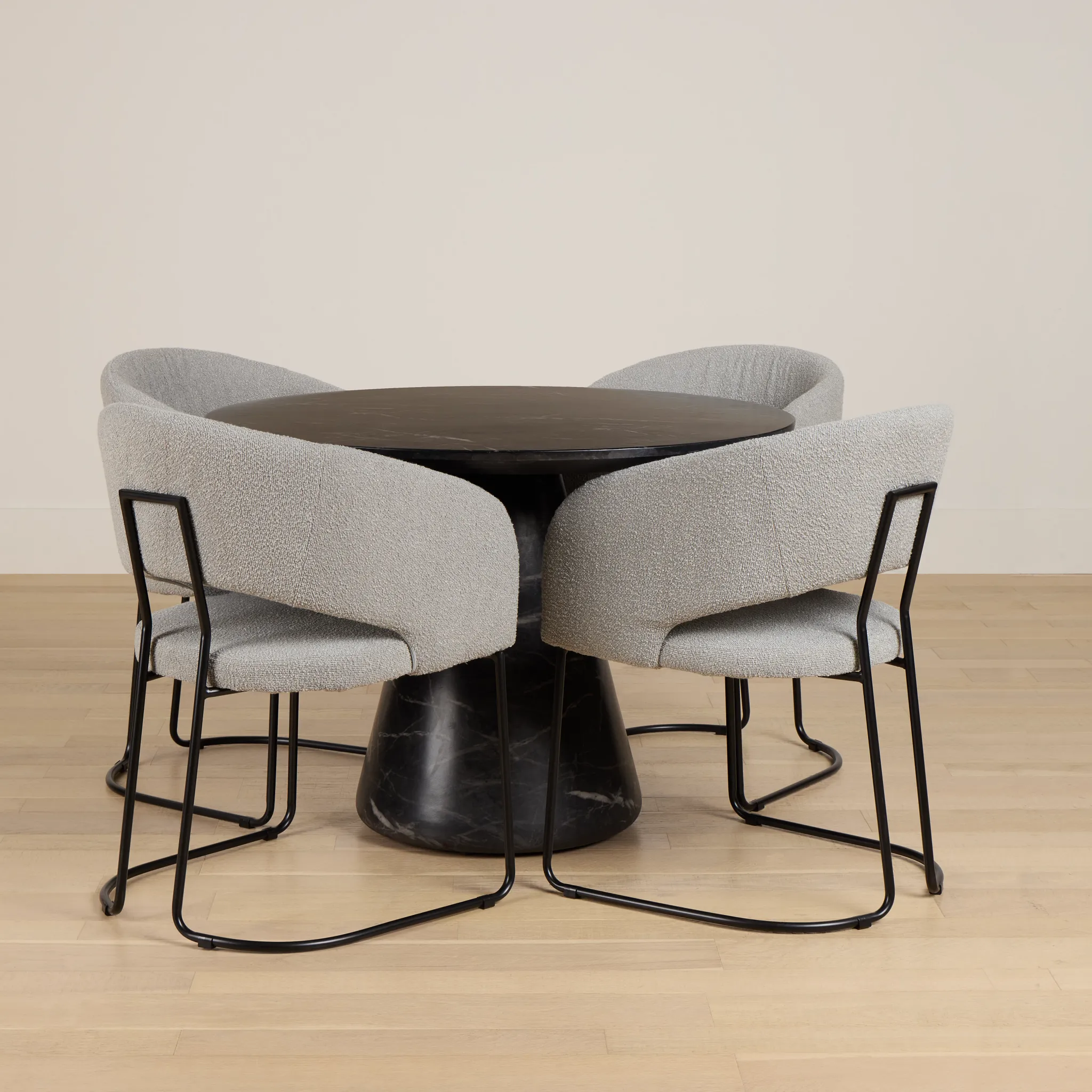 Merrick Black Round Table With 4 Gray Upholstered Side Chairs