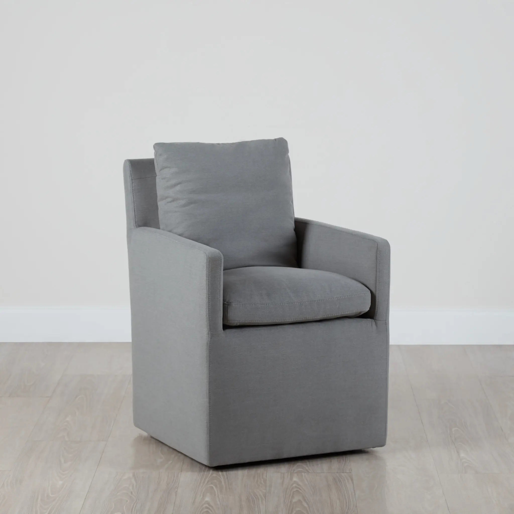 Auden Light Gray Castored Upholstered Arm Chair Auden Light Gray Castored Upholstered Arm Chair