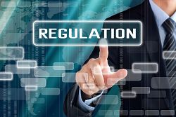 Businessman hand touching REGULATION sign on virtual screen