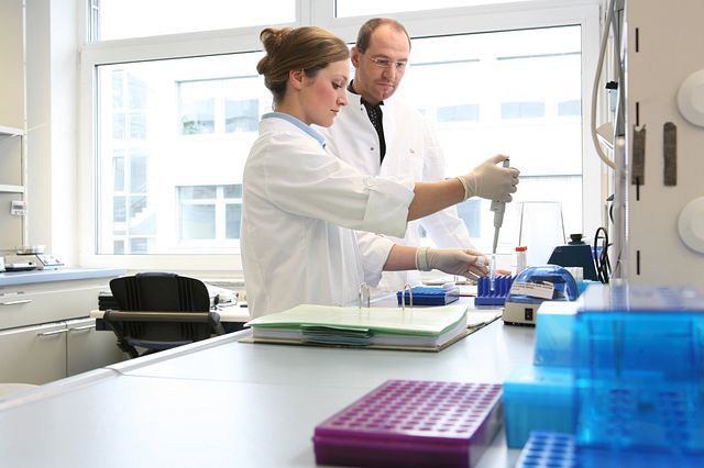 A Charles River scientist is pipetting bioactivity assays into test tubes preparing for a potency testing study.