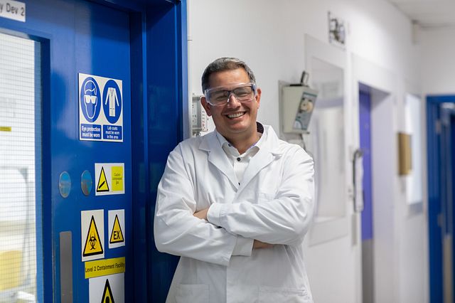 Image of Omar Aziz, a biologist who develops cell-based assays to test the efficacy of compounds for drug development.