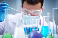 vaccine developer using a pipette